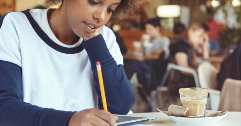 A student jotting down the subjects on the MBE