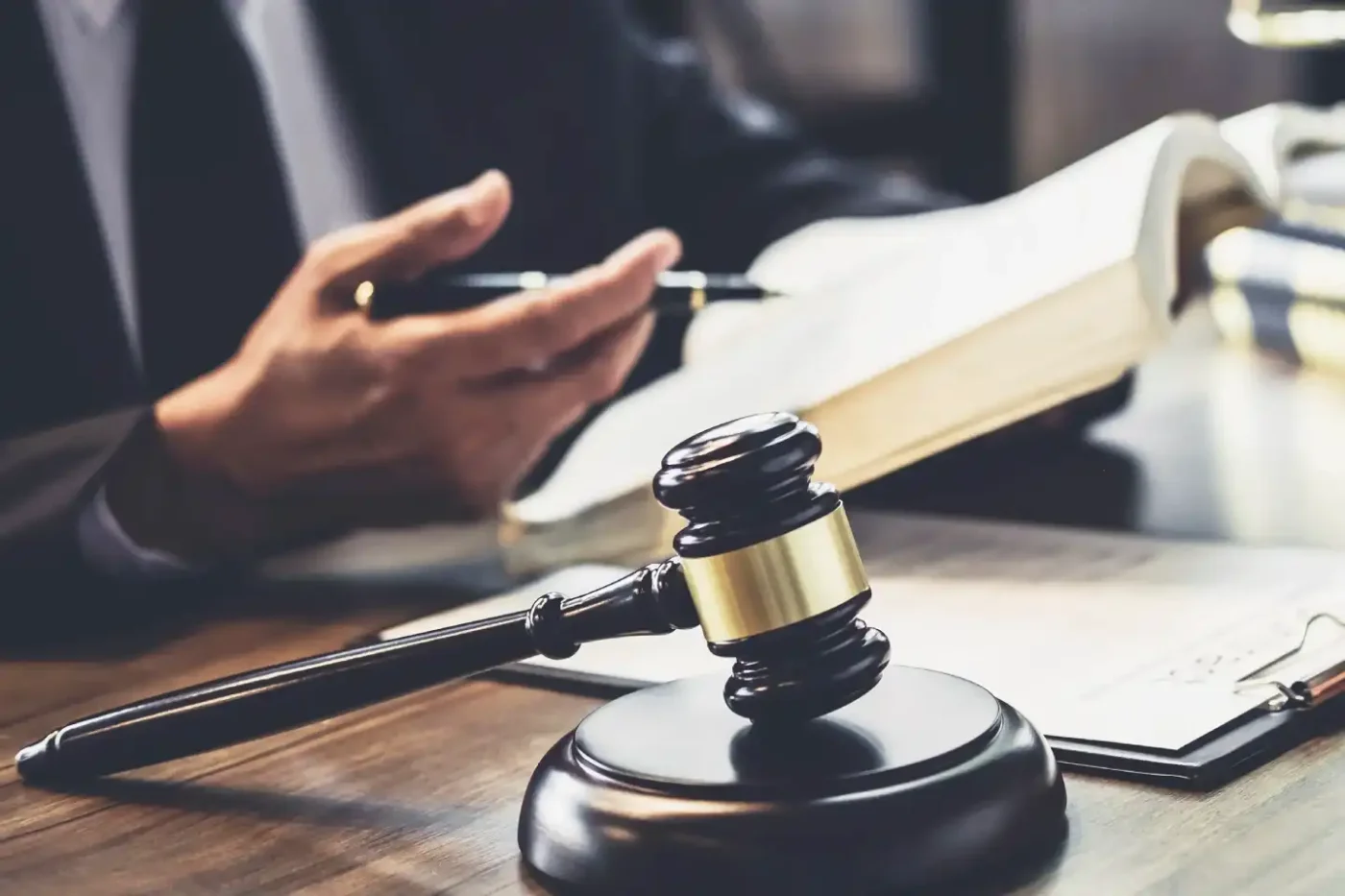 A lawyer citing applicable law to a client from a legal book.