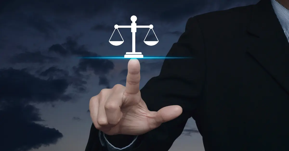 Law student in a suit pointing at a digital justice scale icon, symbolizing legal technology innovation and modern bar exam preparation with Themis Bar Review.