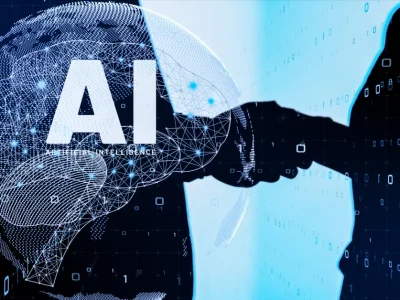 AI concept image featuring a digital brain formed by neural network connections, with a handshake between a human and a robot symbolizing collaboration between artificial intelligence and humans.